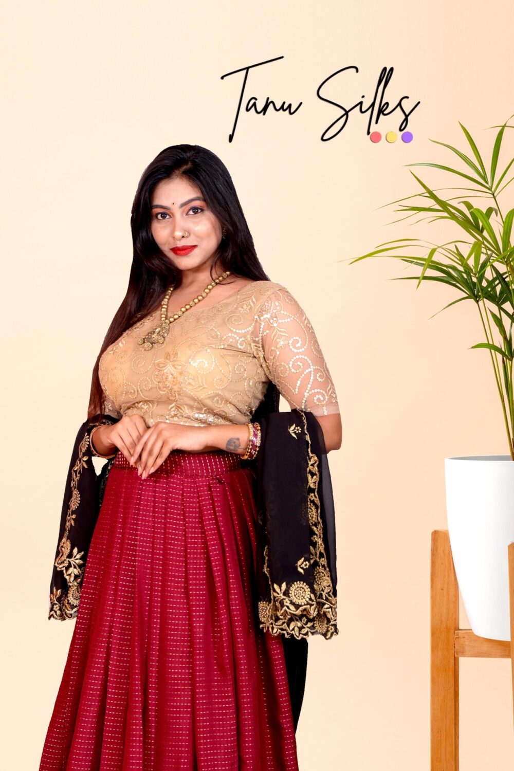 Maroon lehenga and gold netted blouse